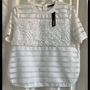 new INA sassy off white top, fancy t-shirt with fun details.  Large